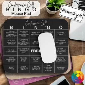 May include: A black and white conference call bingo mouse pad with a white mouse on top. The bingo card has phrases like "Can you share your screen?" and "I'll drop the link in the chat".