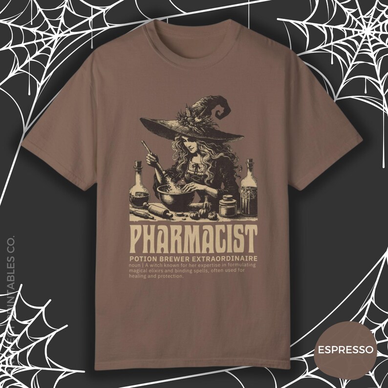 May include: A brown t-shirt with a graphic of a witch brewing a potion in a cauldron. The text "Pharmacist Potion Brewer Extraordinaire" is printed below the image. The text "noun | A witch known for her expertise in formulating magical elixirs and binding spells, often used for healing and protection." is printed below the text.