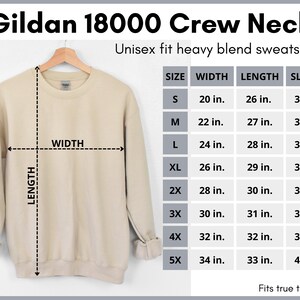 May include: A beige Gildan 18000 Crew Neck unisex fit heavy blend sweatshirt with size chart showing width, length, and sleeve measurements in inches.