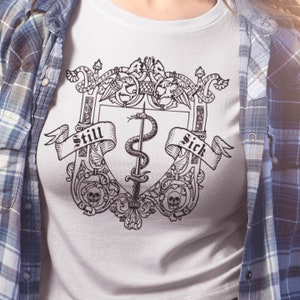 STILL SICK Shirt, Chronic Illness Badass Tshirt, Funny Spoonie Warrior Tee, Invisible Disability Chronic Pain Fibromyalgia Fatigue Migraine