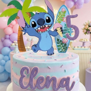 May include: A birthday cake with a Stitch theme. The cake is decorated with blue, pink, and purple stripes, and topped with a Stitch figurine, a surfboard, and the number 5. The name "Elena" is written on the cake in purple letters.