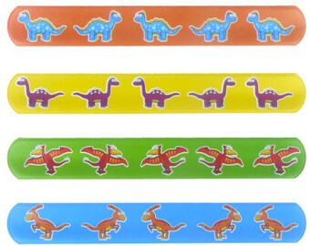 May include: Six colorful silicone wristbands with dinosaur designs. The wristbands are red, orange, yellow, green, blue, and purple. Each wristband features a repeating pattern of dinosaurs.