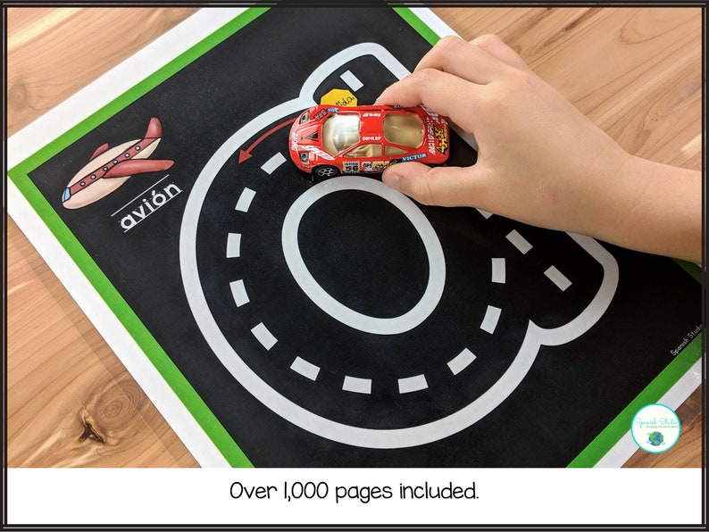 May include: A black and white road track with a red toy car on a green and black background. The Spanish word "avi&oacute;n" is written on the background.