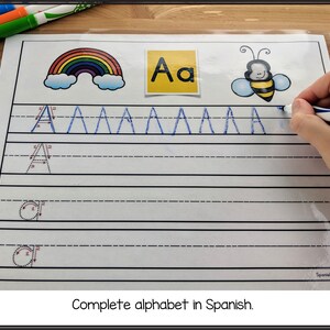 May include: A Spanish alphabet tracing worksheet with a rainbow, a bee, and a letter A. The worksheet has dotted lines to help with tracing the letter A.