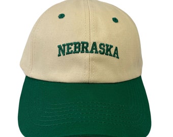 Nebraska Tan Baseball Cap 4 color Secondary Colors Adjustable back Strap.