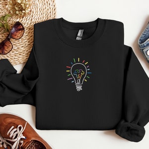 Autism Awareness Sweatshirt: Light Bulb Puzzle Piece Embroidery