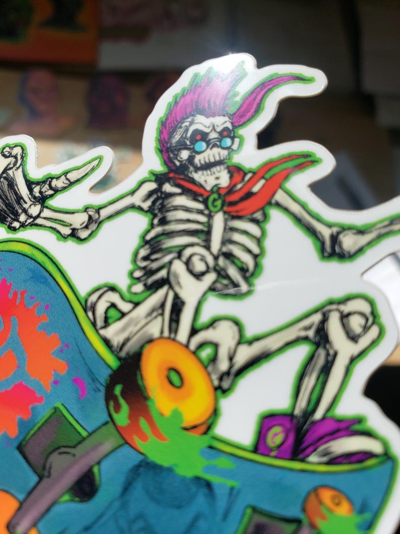 May include: A skeleton wearing red and green clothing and blue goggles is skateboarding. The skateboard is blue and green with orange wheels and has paint splatters on it.