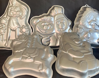 5 Different Vintage Wilton Cake Pan Molds - Pocahontas, Bert and Ernie, Little Suzie’s Zoo, Carousel Horse, and Winne the Pooh