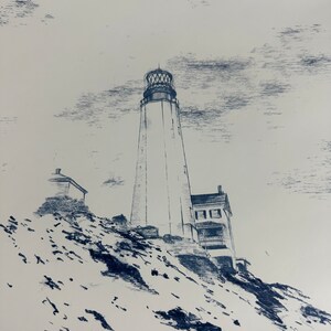 May include: A black and white pencil drawing of a lighthouse on a rocky cliff. The lighthouse is tall and slender with a white tower and a black roof. The sky is cloudy and the drawing is done in a realistic style.