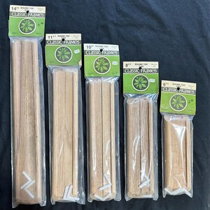 May include: Five packages of unfinished wood picture frames in various sizes. The packages are labeled with the size of the frame in inches, "Round Top", "Oak", and "Classic Frames".