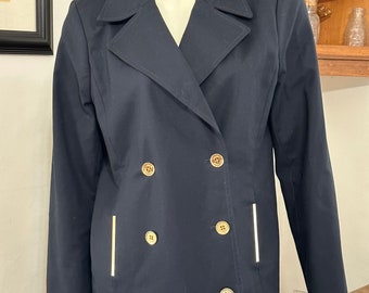 May include: A navy blue double-breasted blazer with gold buttons and white piping on the pockets.