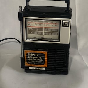 Vintage General Electric portable radio, model 7-2929A, features AM, FM, and TV bands  - Tested works!