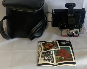1975-1977 Vintage polaroid supershooter plus instant landcamera met originele polaroidleren tas en originele handleiding.