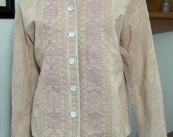 May include: A light pink suede jacket with a button-up front and pink embroidered details.