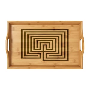 May include: Rectangular bamboo serving tray with a dark brown maze design in the centre. The tray has built-in handles on each side. The bamboo has a light brown colour.