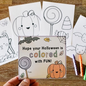 May include: A Halloween-themed card with a pumpkin, lollipop, and bat. The card says "Hope your Halloween is colored with FUN!"