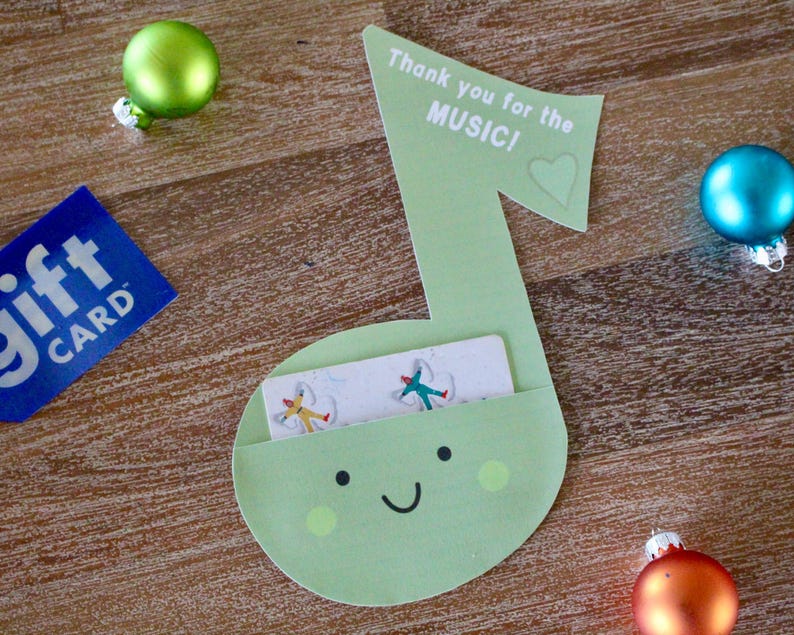 May include: A green paper music note with a gift card slot. The note has a smiley face and the text "Thank you for the MUSIC!" with a heart.
