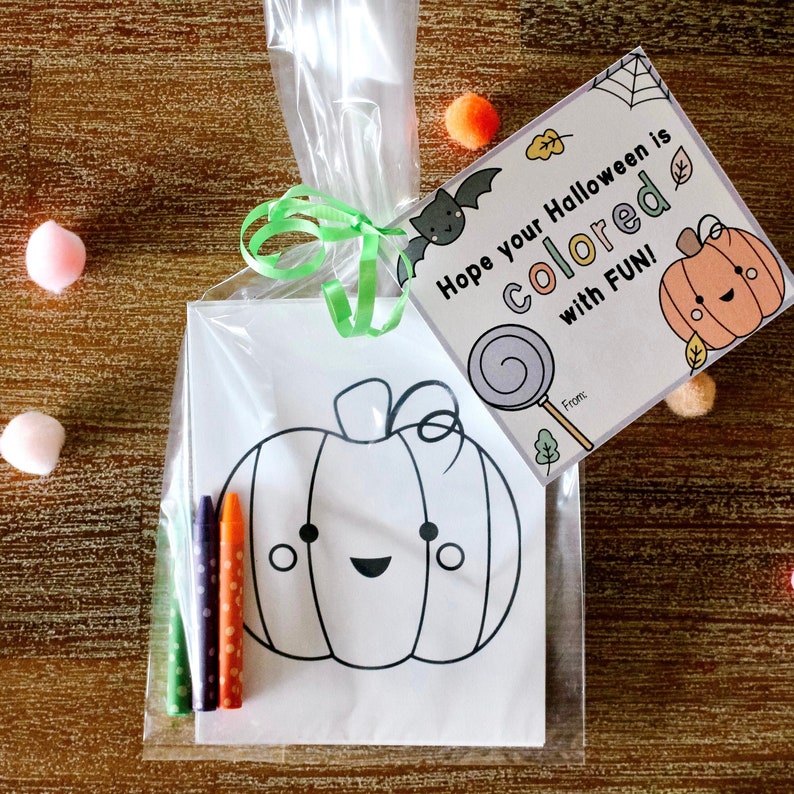 May include: A clear plastic bag filled with a coloring page of a pumpkin with a happy face, four crayons, and a card that says "Hope your Halloween is colored with FUN!"