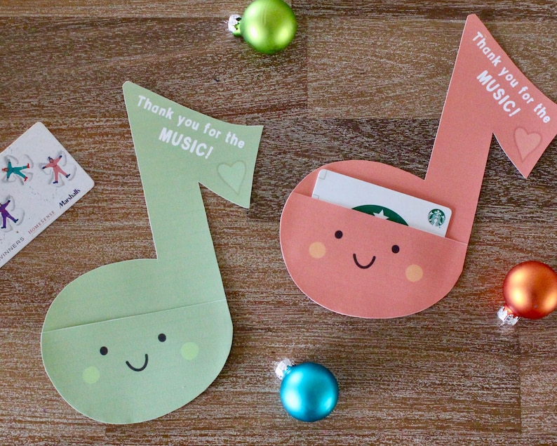 May include: Two green and pink paper music note gift card holders with the text "Thank you for the MUSIC!" and a smiley face. The pink holder has a gift card inside.