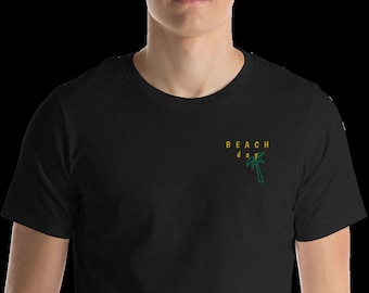 May include: Black t-shirt with a yellow and green palm tree graphic and the text "BEACH day" on the front.