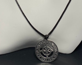 Black cord necklace with antique silver tone pendant