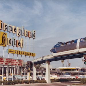 Iconic Monorail over Disneyland Hotel Framed poster