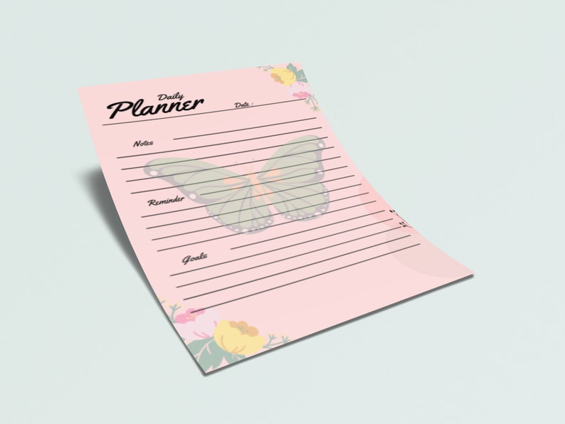 May include: A pink daily planner with a butterfly design and floral accents. The planner has sections for notes, reminders, and goals.