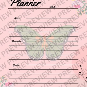 May include: A pink daily planner with a butterfly design and floral accents. The planner has sections for notes, reminders, and goals.