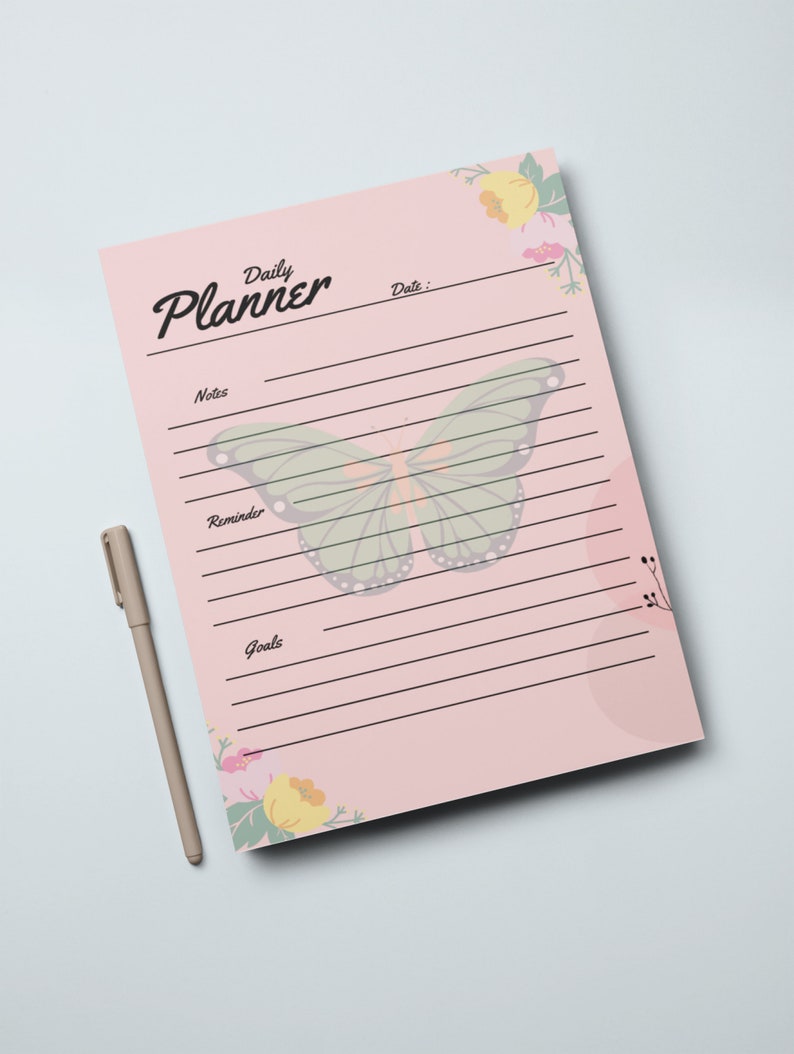 May include: A pink daily planner with a butterfly design and floral accents. The planner has sections for notes, reminders, and goals.