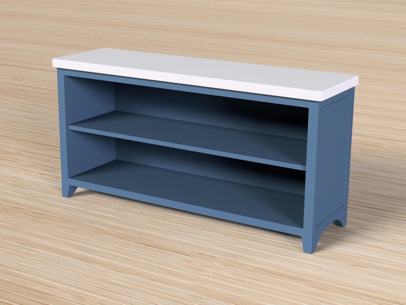 Pode incluir: Um arm&aacute;rio de armazenamento azul com duas prateleiras e um tampo branco. O arm&aacute;rio &eacute; feito de madeira e tem um design simples e moderno. As prateleiras s&atilde;o perfeitas para guardar livros, decora&ccedil;&atilde;o ou outros itens.