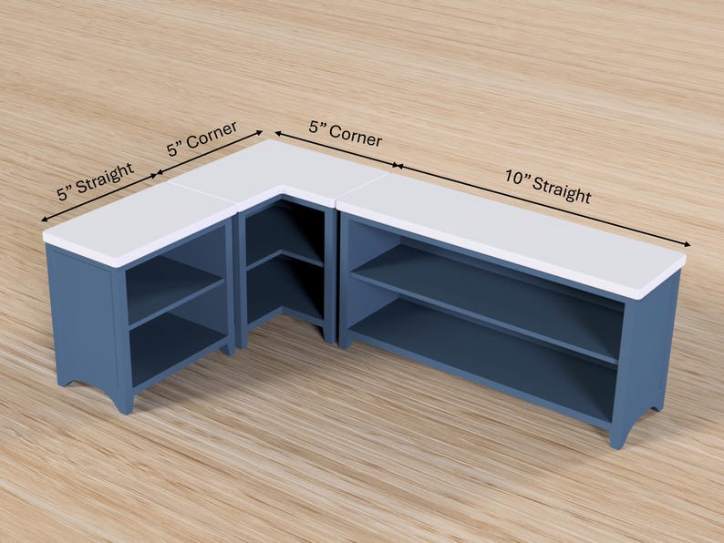 Pode incluir: Um arm&aacute;rio de canto azul com uma bancada branca. O arm&aacute;rio tem prateleiras abertas e mede 12,7 cm reto, 12,7 cm canto e 25,4 cm reto. O arm&aacute;rio &eacute; feito de madeira e tem um design moderno.