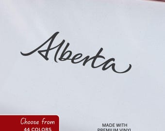Adesivo de vinil com o nome da província de Alberta em formato de script.