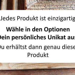 May include: A stack of wooden picture frames with a natural, weathered brown grain texture. A white rectangular sign is overlaid on the frames with the German text: Jedes Produkt ist einzigartig. W&auml;hle in den Optionen Dein pers&ouml;nliches Unikat aus. Du erh&auml;ltst dann genau dieses Produkt.