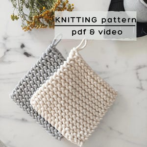 May include: Two square knitted potholders, one in light gray and one in cream, each featuring a thick braided texture and a small hanging loop. The image includes the text KNITTING pattern pdf & video overlaid on the upper portion of the frame.