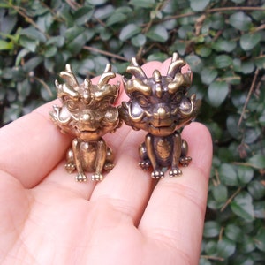 May include: A set of three ceramic mugs with a speckled, matte finish. The mugs are in shades of cream, light gray, and dark gray. Each mug has a simple, minimalist design, perfect for coffee or tea.