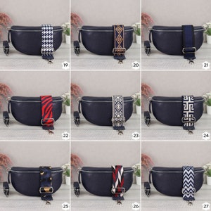May include: A set of ten navy blue leather fanny packs with different patterned straps. The straps are made of fabric and feature various geometric and animal prints.