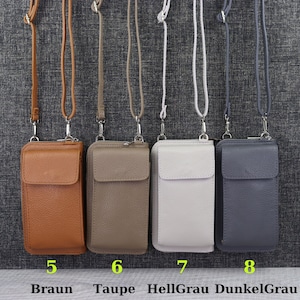 May include: Four leather phone pouches with adjustable straps in brown, taupe, light gray, and dark gray. The pouches are numbered 5 through 8 and labeled with the colors "Braun", "Taupe", "Hellgrau", and "Dunkelgrau".
