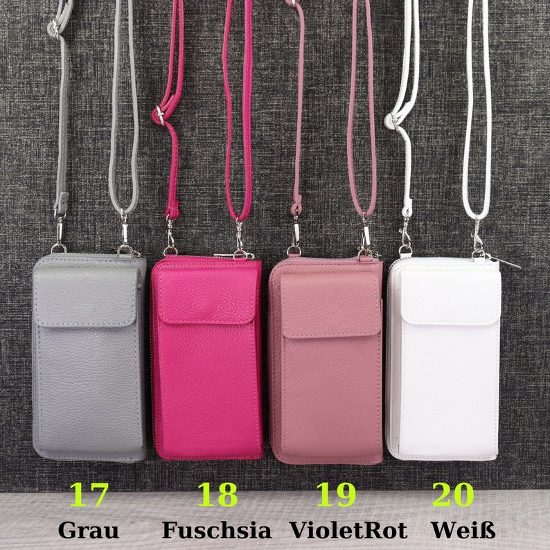 May include: Four different colored leather phone cases with a zipper closure and a long strap. The cases are gray, fuchsia, pink, and white. The numbers 17, 18, 19, and 20 are printed below the cases, with the corresponding color names printed below the numbers.