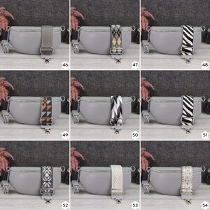 May include: Nine gray crossbody bags with different patterned straps. The straps are black and white, black and gray, brown and white, and other patterns. The bags are all the same shape and size.