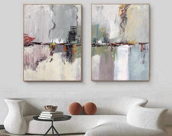 May include: Two rectangular canvas paintings featuring abstract brushstrokes in shades of gray, white, beige, and muted green, with accents of red and dark brown. The artwork displays layered textures and vertical lines across both panels.