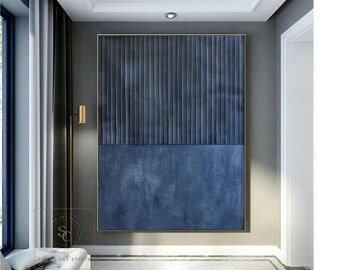 May include: A large rectangular wall art piece featuring a two-part composition. The top half consists of dark blue vertical textured ridges, while the bottom half displays a solid, flat dark blue surface with a subtle, mottled paint finish.