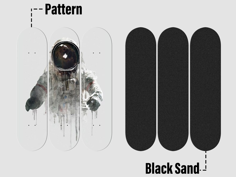 May include: Three blank skateboard decks with a graphic of an astronaut in a white spacesuit with a black helmet. The astronaut is in front of a white background with black and gray paint splatters. The decks are arranged in a row with the astronaut in the middle. The decks are labeled "Pattern". Three black skateboard grip tape sheets are arranged in a row below the decks. The grip tape sheets are labeled "Black Sand".