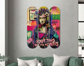 May include: Three colorful skateboard decks with graffiti art and the text "YOUF THIS SEE YOU IN PARIS".