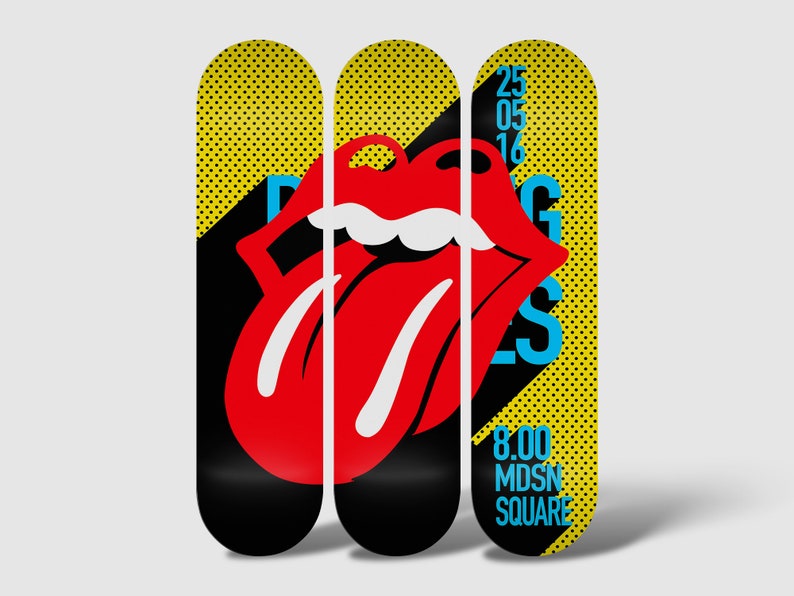 May include: Three yellow and black skateboard decks with a red tongue and lips graphic and the text "Rolling Stones" in blue. The right deck also has the text "25 05 16" and "8.00 MDSN SQUARE" in blue.