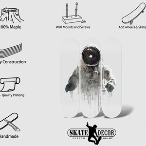 May include: A skateboard deck with a black and white illustration of an astronaut in a space suit. The deck is made of 7-ply maple wood and is ready to be customized with wheels and trucks. The deck is handmade and features high-quality printing. The image also includes text that says "SKATE DECOR CUSTOM WALL ART".