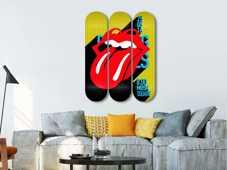 May include: Three yellow and black skateboard decks with a red tongue and lips graphic. The middle deck has the text "25 05 16" and the right deck has the text "8.00 MD SN SQUARE".