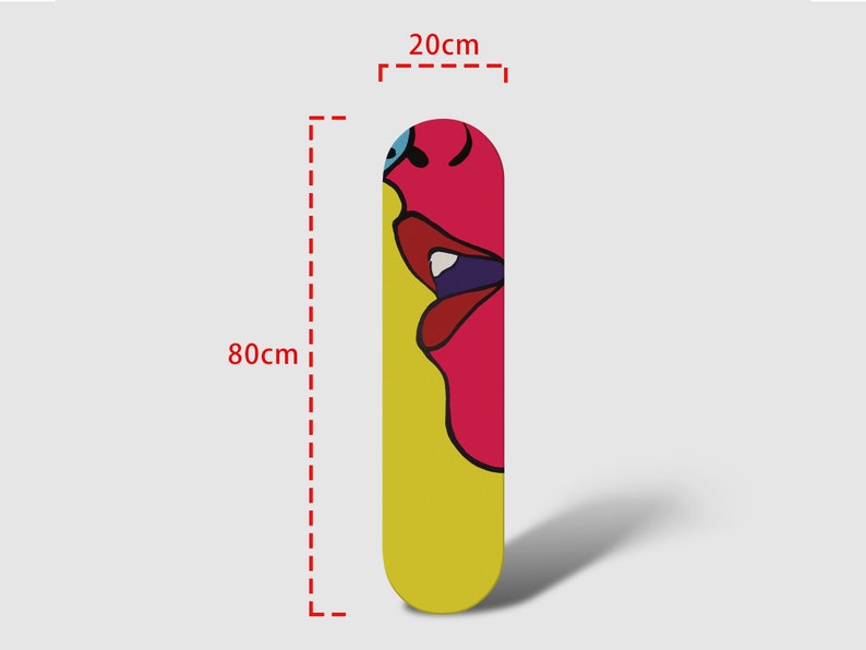 May include: A yellow and pink skateboard deck with a colorful abstract face design. The deck is 80 cm long and 20 cm wide.