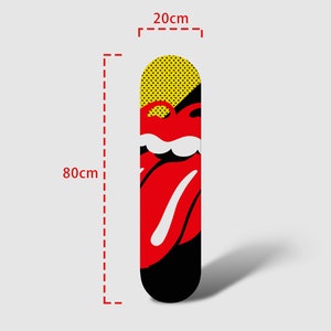 May include: A black and red skateboard deck with a yellow and black polka dot design at the top. The deck features a red tongue with a white stripe and a white mouth. The skateboard is 80 cm long and 20 cm wide.