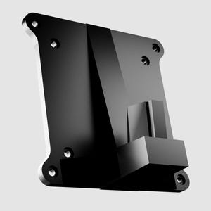 Puede incluir: Objeto geométrico negro y angular con base rectangular y múltiples orificios circulares. El objeto tiene un acabado brillante y parece estar hecho de un material sólido. El diseño es moderno e industrial.