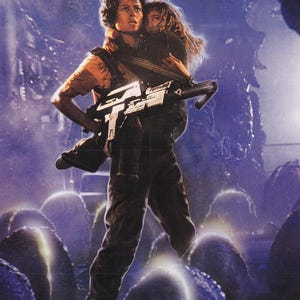 May include: Movie poster for the film "Aliens." The image features a person holding a child and a large weapon, set against a dark, ominous background. The title "ALIENS" is displayed at the top.